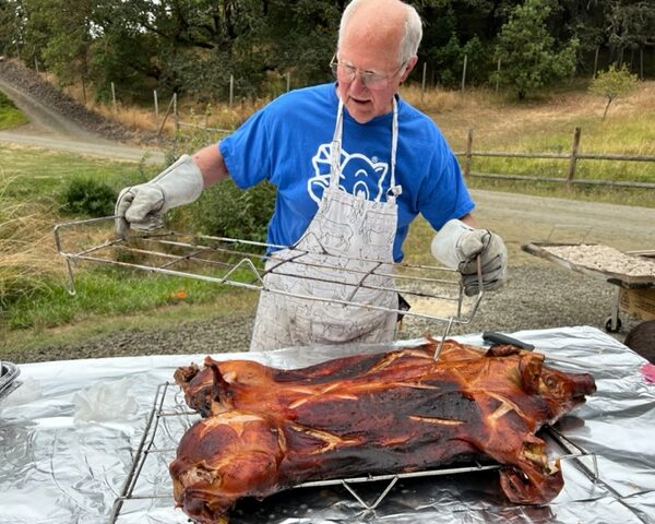 Image of Larry with roasted pig